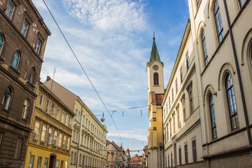 Obraz premium old city street with church tower