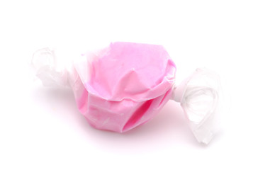 Single Piece of Pink Salt Water Taffy on a White Background
