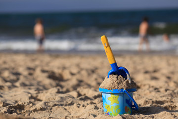 toys on the sandy beach by the sea.