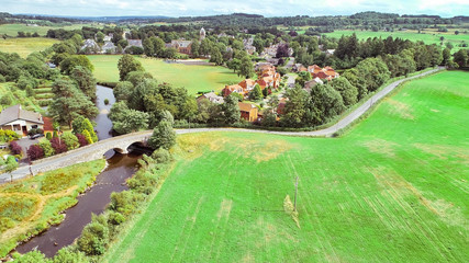 Aerial image over Quarriers village and surrounding countryside in West Central Scotland.