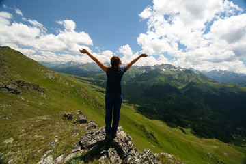 Young woman in the mountains of Arkhyz. Zagedanskiy ridge.