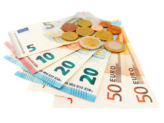Euro banknotes and euro coins isolated on white background.