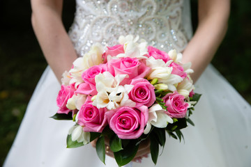Bride with wedding bouquet, closeup
