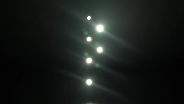 Set of concert lights flashing and moving on stage