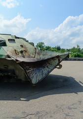 Military conflict and broken military equipment. Hit the projectile in a sheet of armor