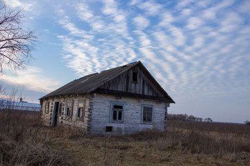 old wooden house at sunset