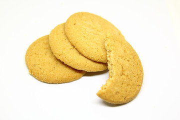 Sweet brown oatmeal cookies isolated over a white