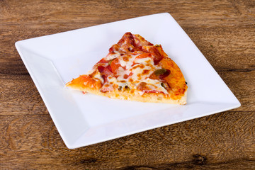 Pizza with sausages and tomato