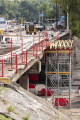 Fragment of structures when repairing an automobile bridge with installed scaffolding