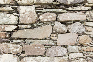 A rustic stacked stone wall