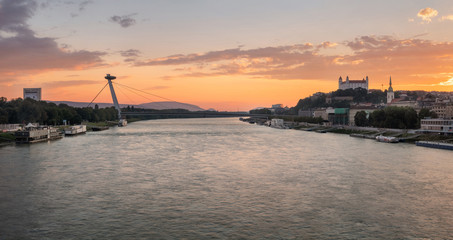 Panorama view on Bratislava castle and SNP Bridge (UFO) over the river Danube in Bratislava city,...