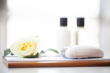 Wellness Products and Cosmetics. Spa still life with blossoms of rose and essential oils