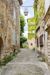 Fototapeta na wymiar Narrow street of village Gordes in Provence, France