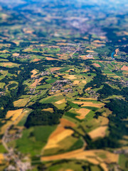 Top aerial view of country side in Switzerland at summer time. Tilt shift effect