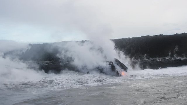 Molten Lava Streams from Hawaii's Kilauea Volcano Into the Ocean At Dawn