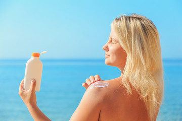 Woman With Suntan Lotion