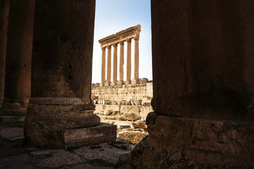The high columns of the Jupiter Tempel of Baalbek seen through columns, Lebanon