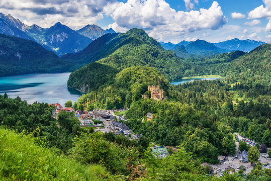 Fussen, Germany- June 10, 2018: Lake Alpsee and Hohenschwangau Castle. View of Schloss Hohenschwangau, ancestral home to Bavaria&rsquo;s King Ludwig II, builder of some of Germany&rsquo;s most famous castles.
