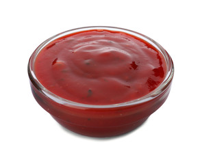 Bowl of spicy chili sauce on white background