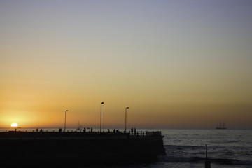 Fototapeta na wymiar Sun Setting Over The Promenade Near Cape Town, South Africa