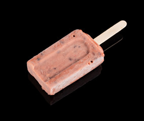 red bean popsicle on a black background