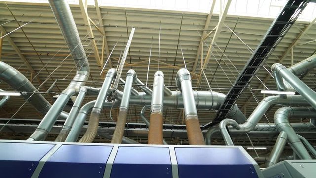 Industrial zone. Steel pipelines, valves, cables and walkways