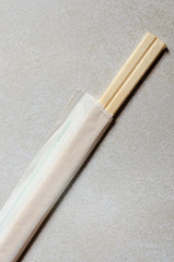 Two new unsplt chopsticks in white takeout sleeve