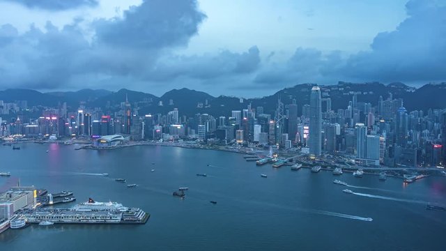 Victoria harbor of Hong Kong city, from day to night