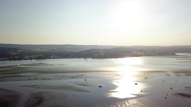 Panning from left to right of the beach and coastal town of Lympstone in England. This island has many beautiful locations which tourists visit daily.