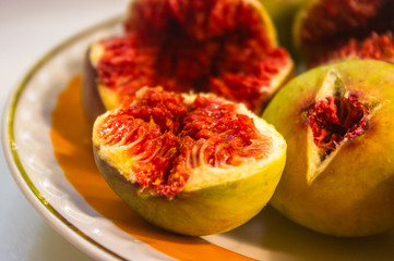 Ripe figs fruit on a plate, close up