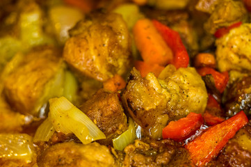 Roast meat, onions, carrots and spices, boiling in oil
