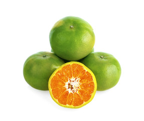 green tangerine isolated on white background.