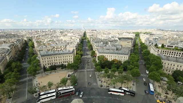 Aerial view of Paris skyline from Arc de Triomphe at sunset light. Triumphal Arch with Place de l'Etoile and Avenue de Wagram road. Paris Capital of France in Europe. Scenic urban cityscape.