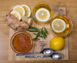 Still life. Tea in transparent cups. Honey, ginger, lemon. From cold and flu.