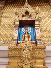 Fototapeta na wymiar Beautiful gold Buddha statue in lotus position with amazing blue background