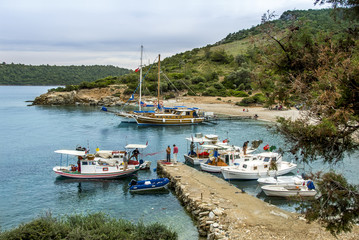 Fototapeta na wymiar Bodrum, Turkey, 28 May 2011: Gulet Wooden Sailboats at Cove of Yaliciftlik Kargicik