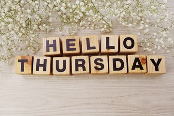 hello thursday alphabet letters on wooden background