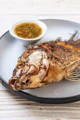 Fried fish with spicy seafood sauce