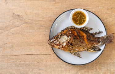 Fried fish with spicy seafood sauce