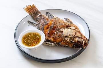 Fried fish with spicy seafood sauce