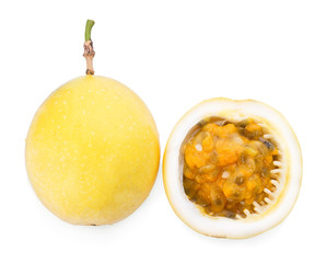 yellow passion fruit with leaf on white background