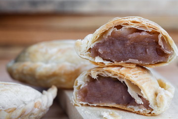 Bakery homemade,Curry puff with stuffed sweet potato on wooden desk.