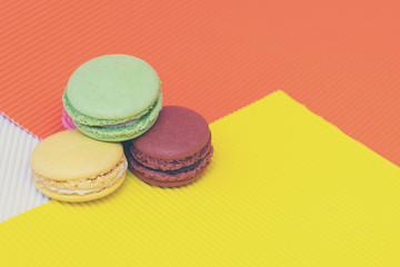 Three colorful tasty macaroons cakes
