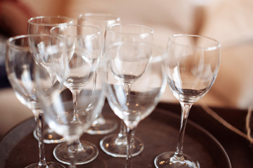 Empty wine glasses on a kitchen counter.