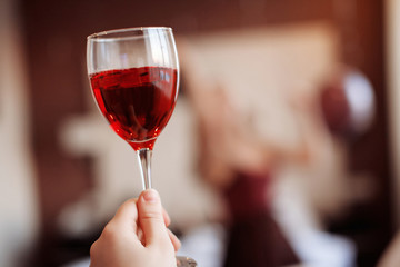 Hand holding a glass of wine