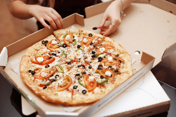 Pretty young sexy fashion sensual woman eating pizza. Crazy night party time,girl eating tasty pizza