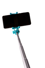 Monopod for selfie with smart phone. Selfie stick with smartphone isolated on white background