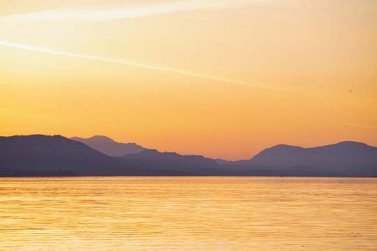 Fototapeta Shoreline of Vancouver Island at sunset from the Salish sea