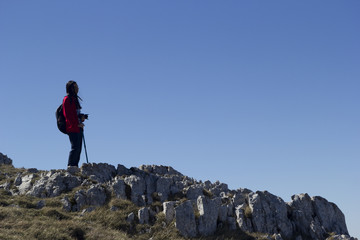 Fototapeta premium girl hiker in mountain summit