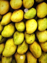 Yellow mangos overhead supermarket